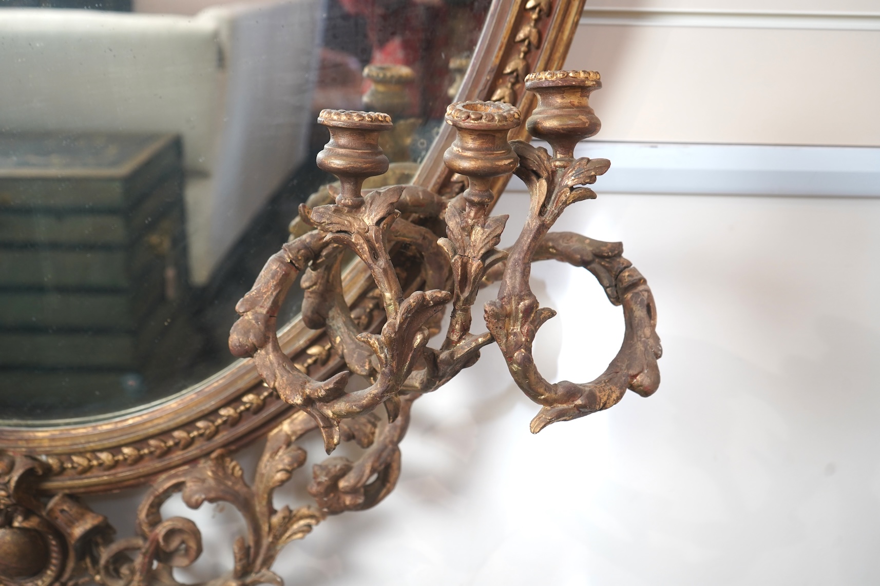 A large Louis XVI style gilt and composition girandole wall mirror